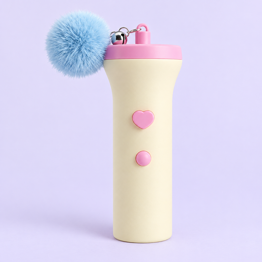 Pixel Pop cat wand launcher in Bubblegum: cream handle, pink cap, light-blue pom-pom
